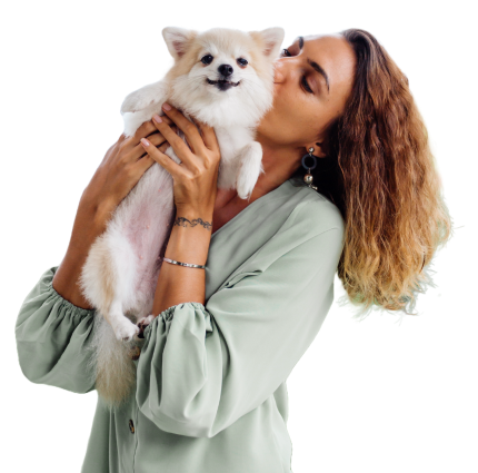 A woman holding a dog